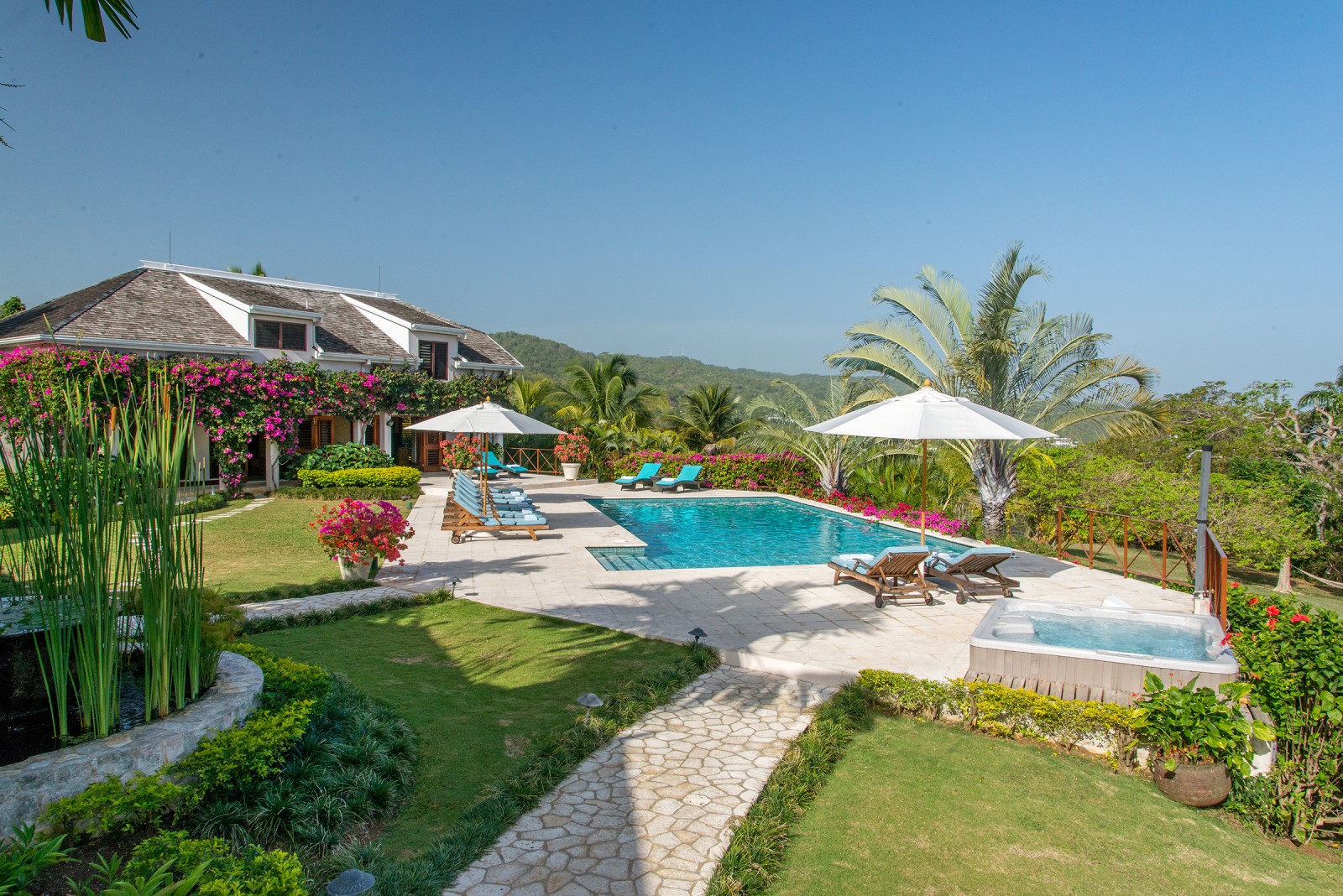 Sugar Hill villa pool, sun loungers and parasols