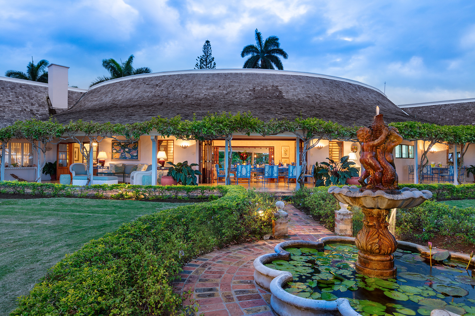 Little Hill villa lit up in the evening