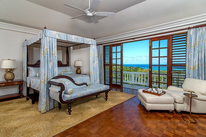 Villa Amana room with chaise lounge overlooking Caribbean Sea