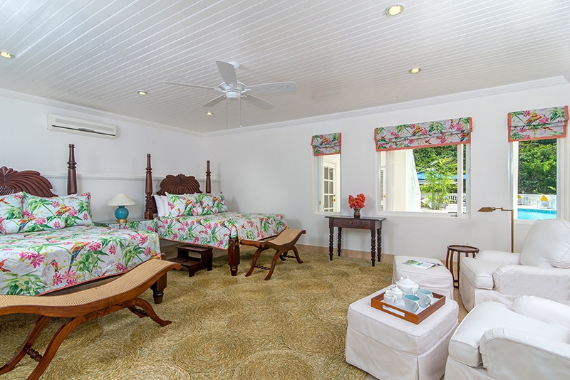 Villa Amana freshly made beds with foot stools