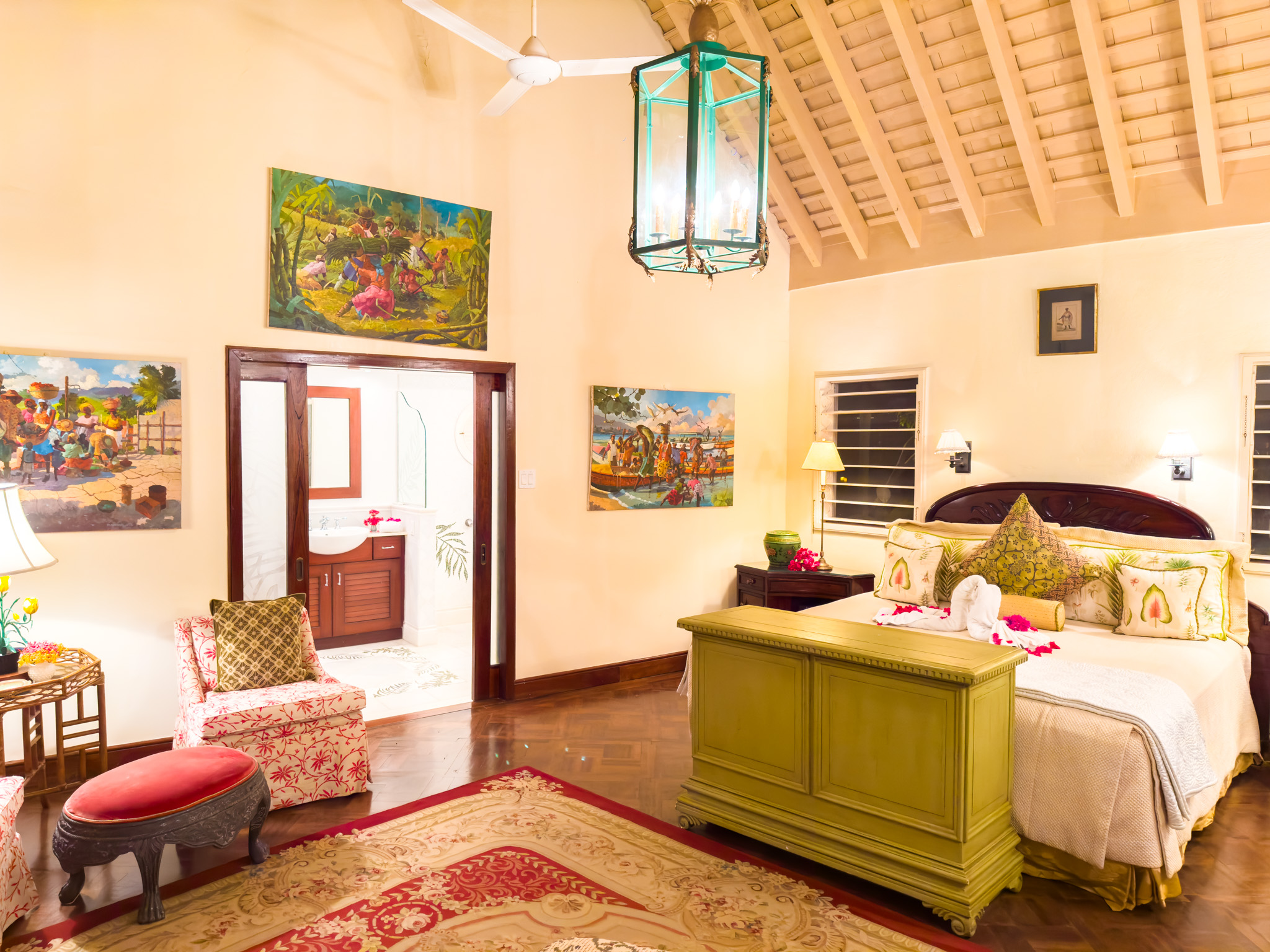 Little Hill villa bedroom with red foot stool