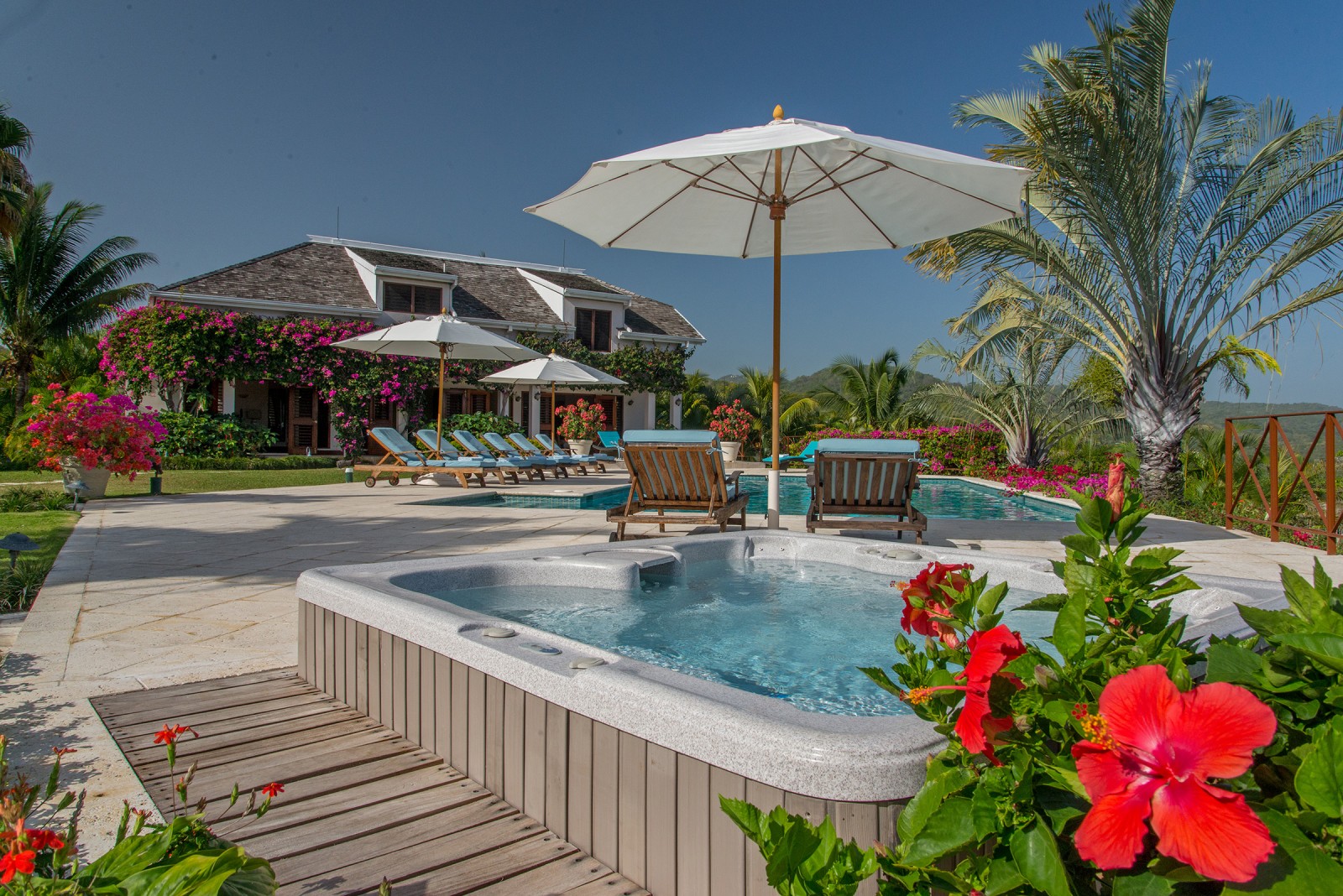 Sugar Hill villa bright red flower, pool and parasol