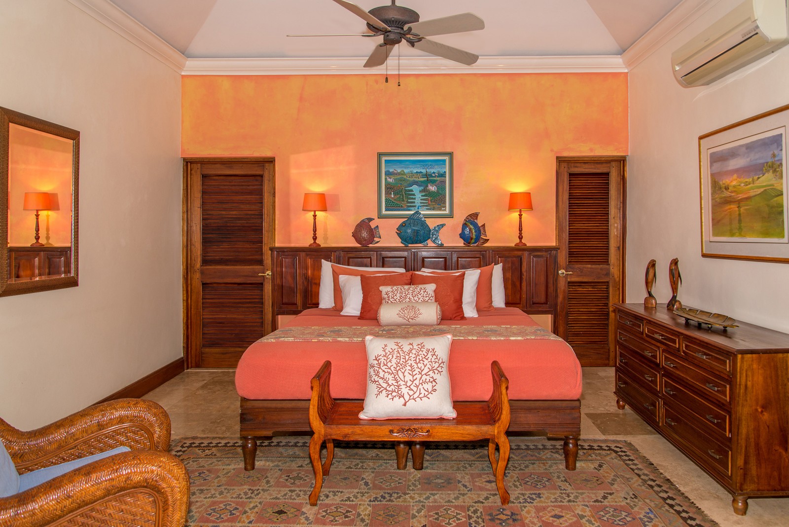 Sugar Hill villa double bed in room with orange decor
