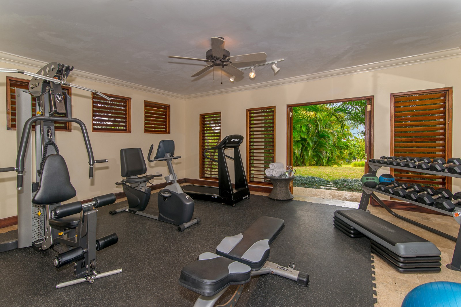Sugar Hill villa gym with various pieces of fitness equipment