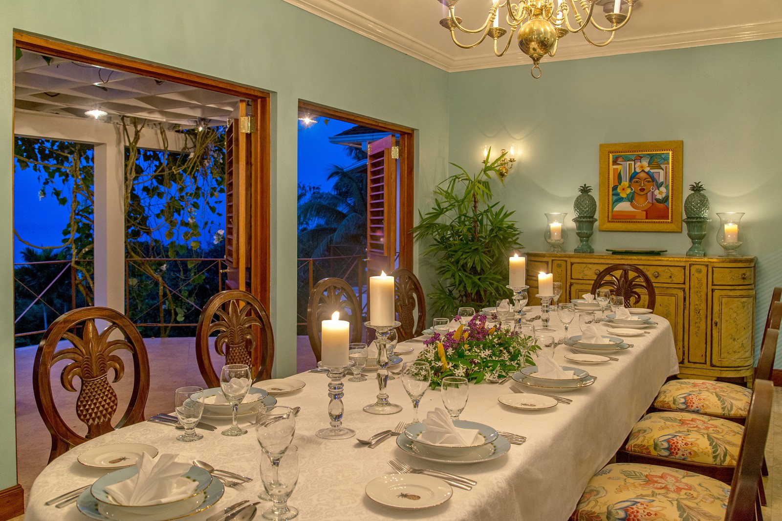 Sugar Hill villa dining table lit by candles in the evening