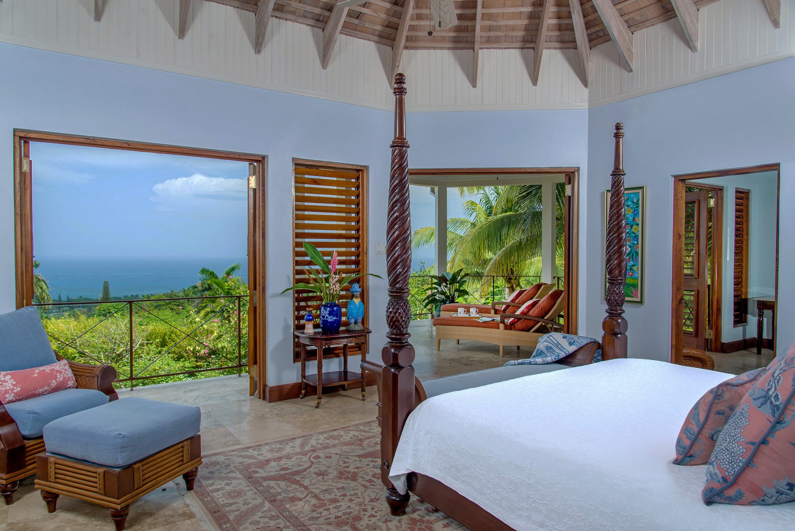 Sugar Hill villa chair and bed in room with a view of the Caribbean Sea