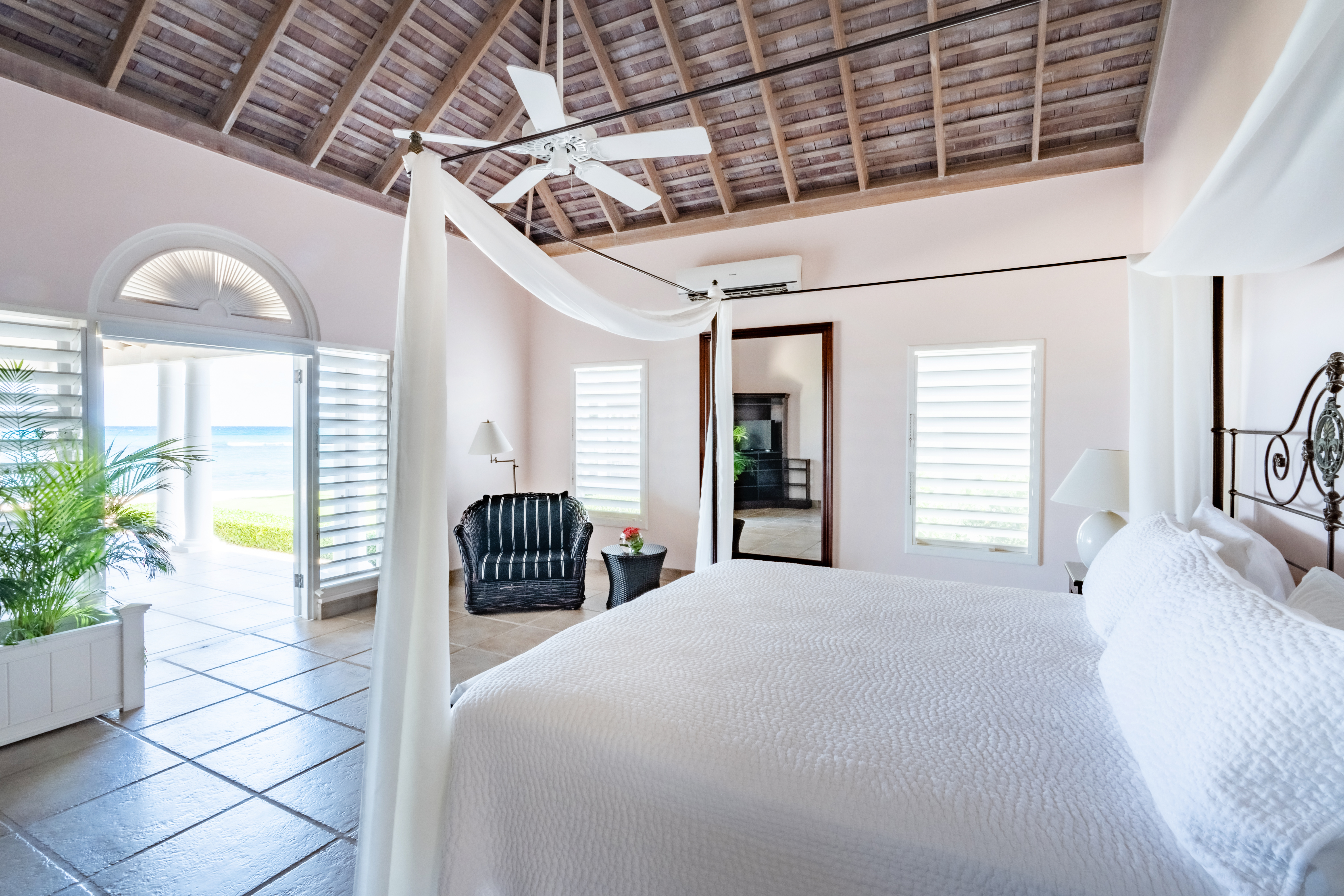 Phoenix villa bedroom with a large bed and open doors