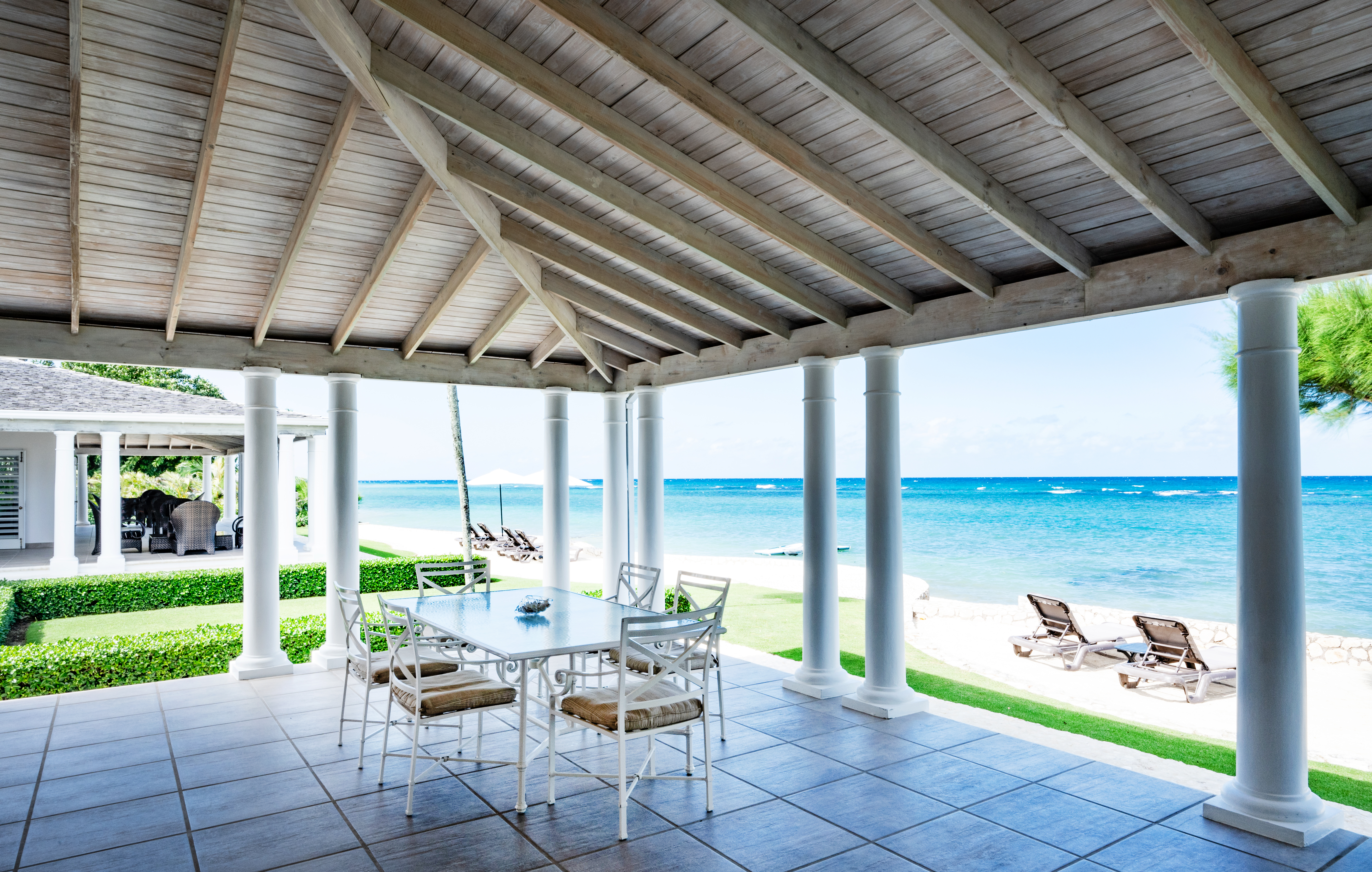 Phoenix villa patio with seating next to the Caribbean Sea