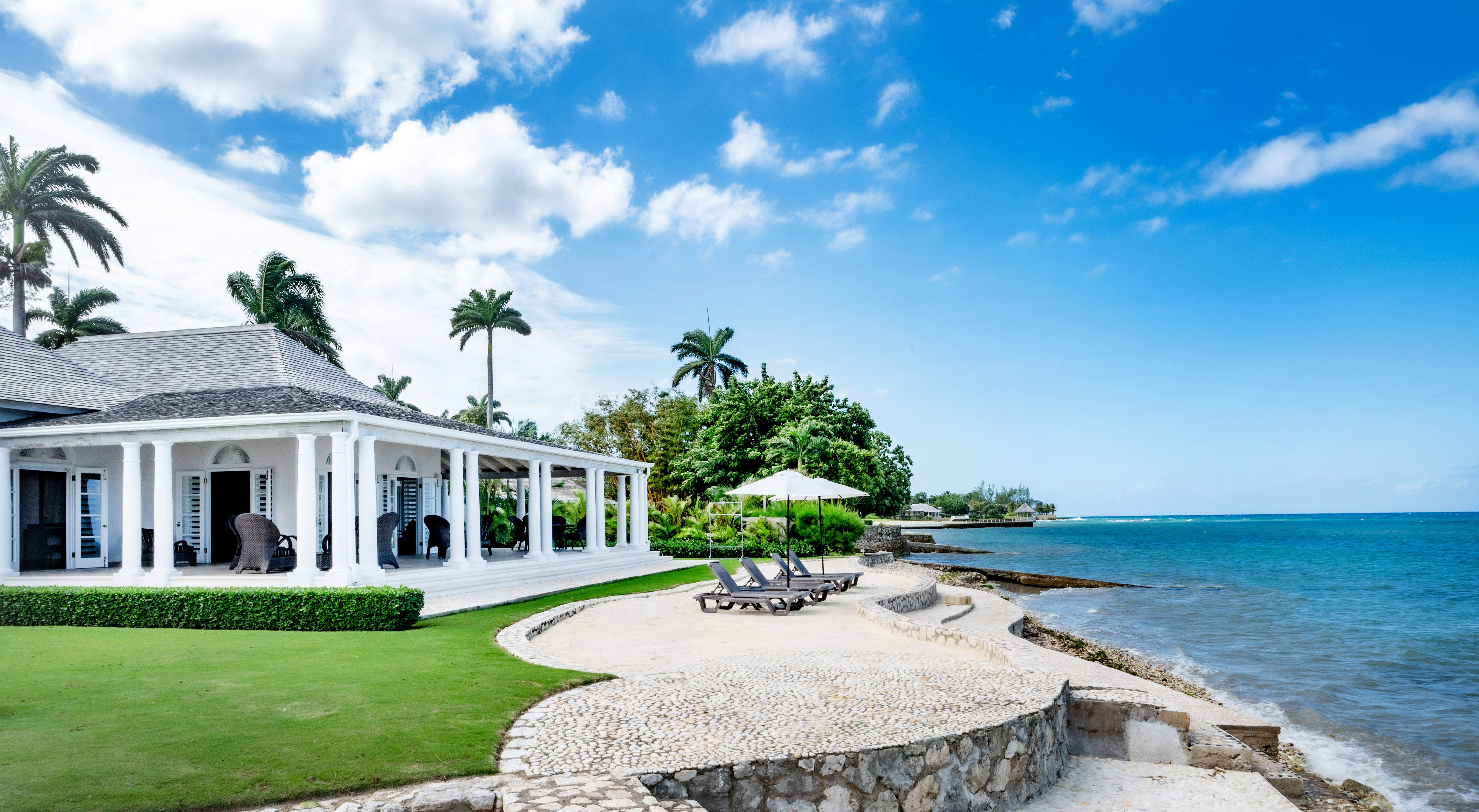 Phoenix villa, sun loungers and Caribbean Sea