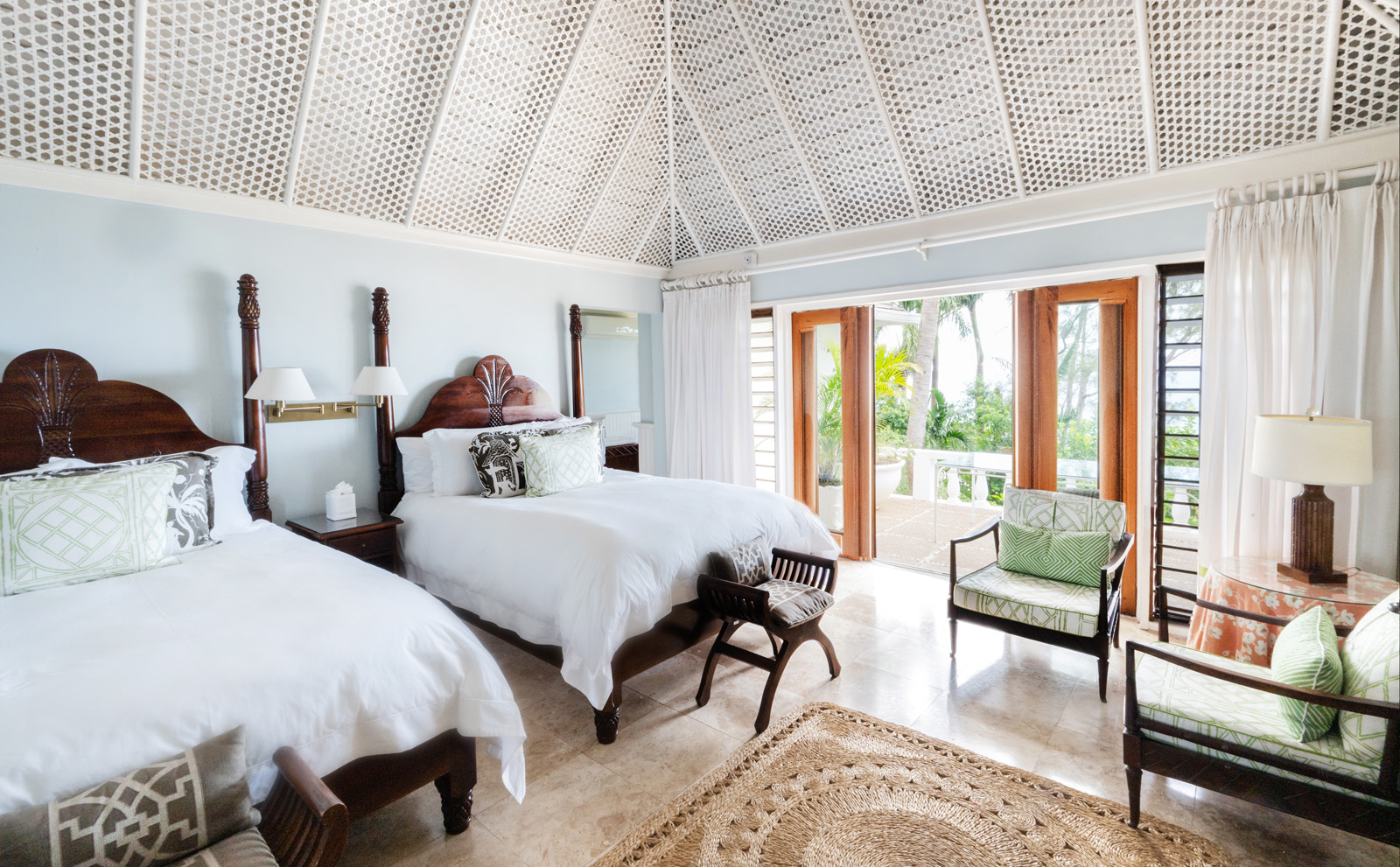 Casuarina villa bedroom with two beds and a chair