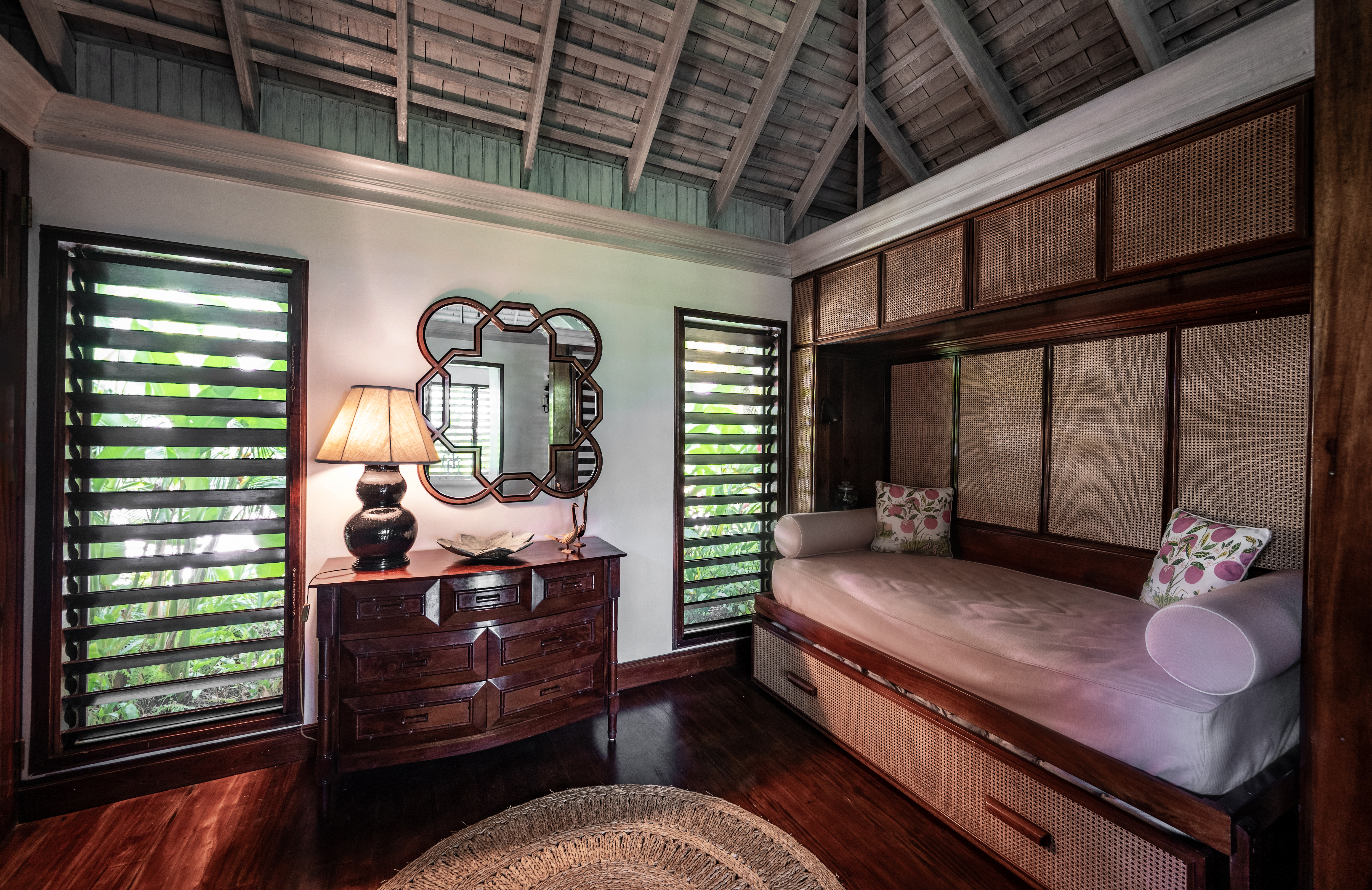 Point of View villa a dark wooden chest of drawers and chais lounge