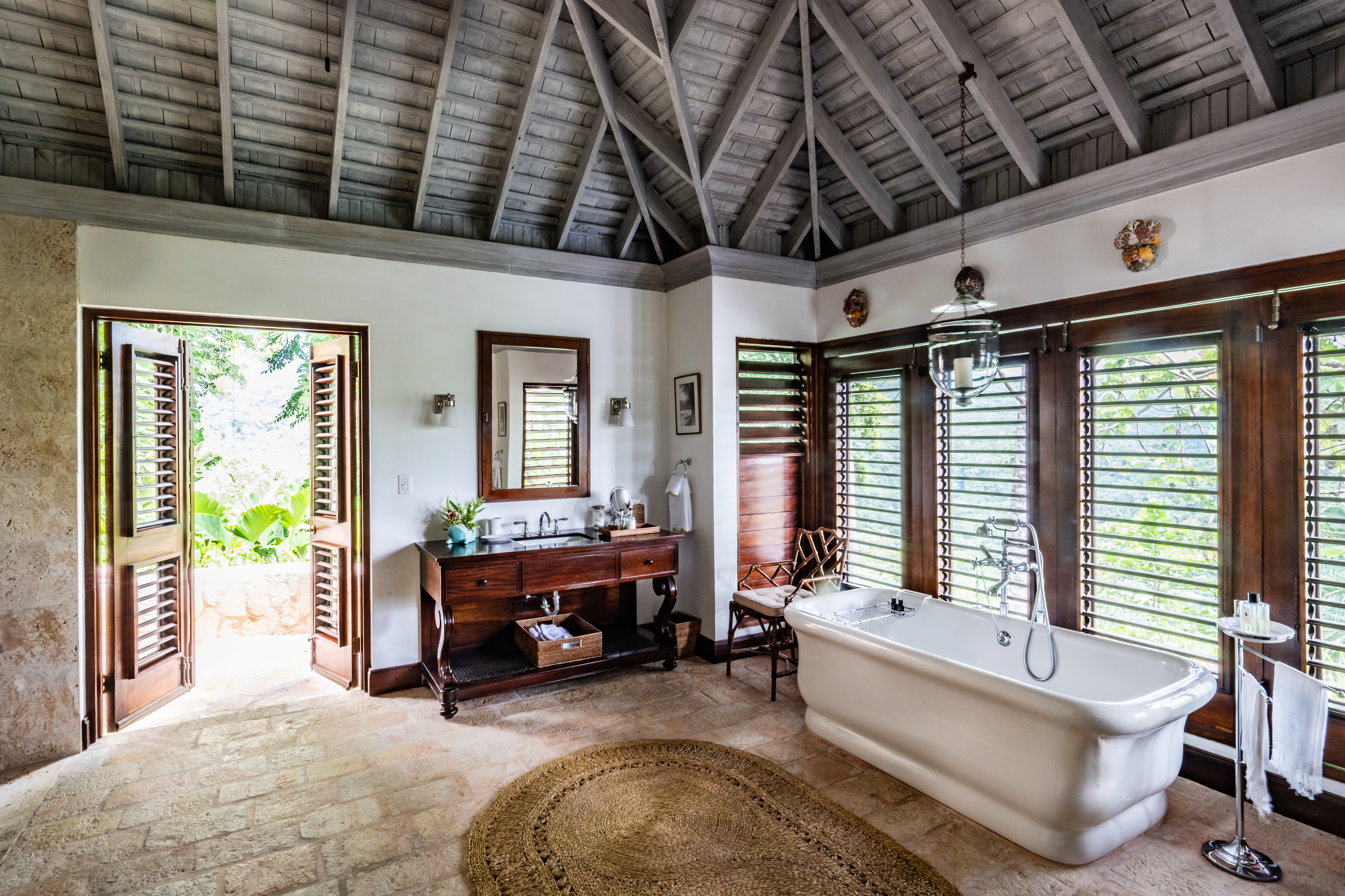 Point of View villa bathroom with a bath and wash basin