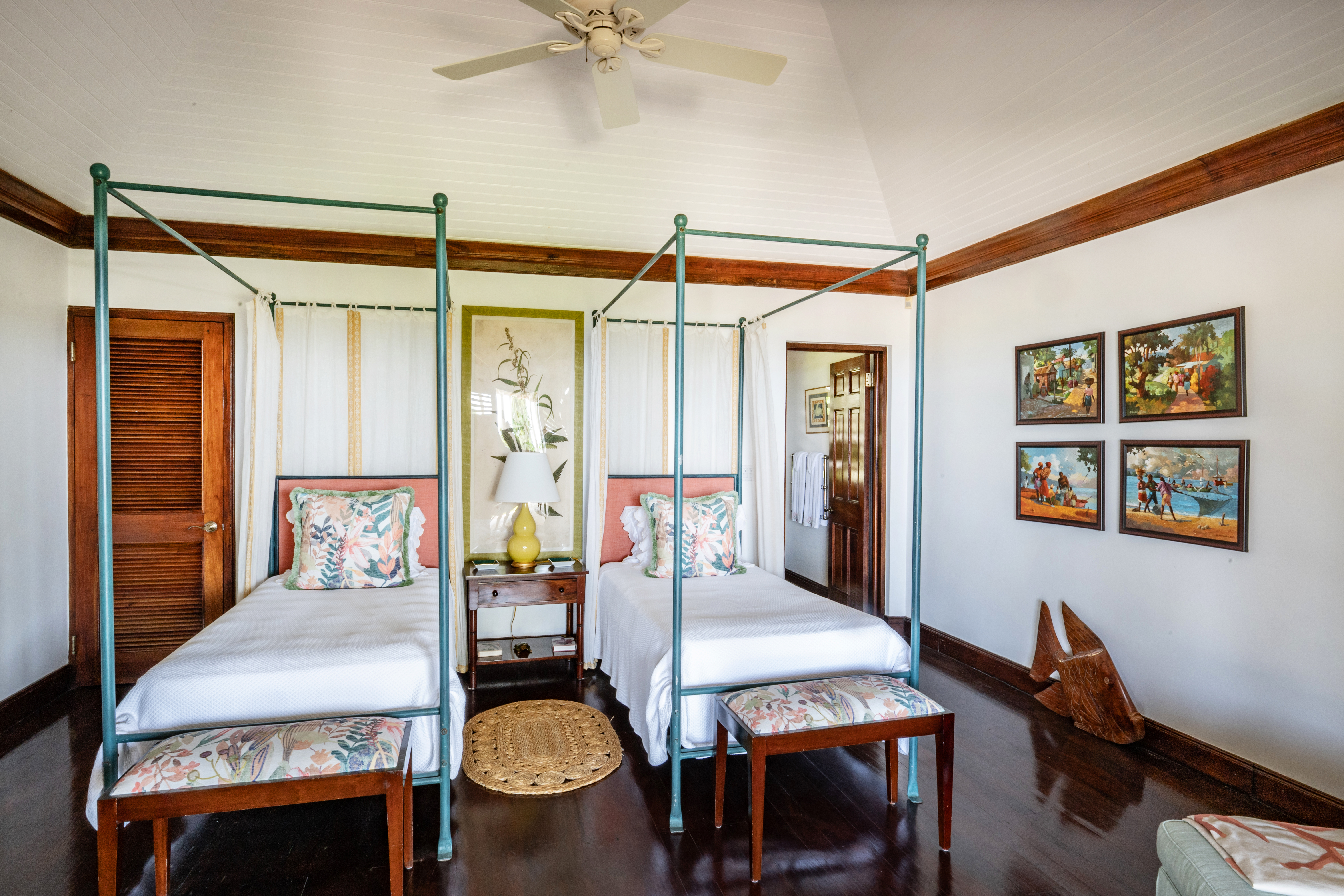 Point of View villa bedroom with two four-poster beds