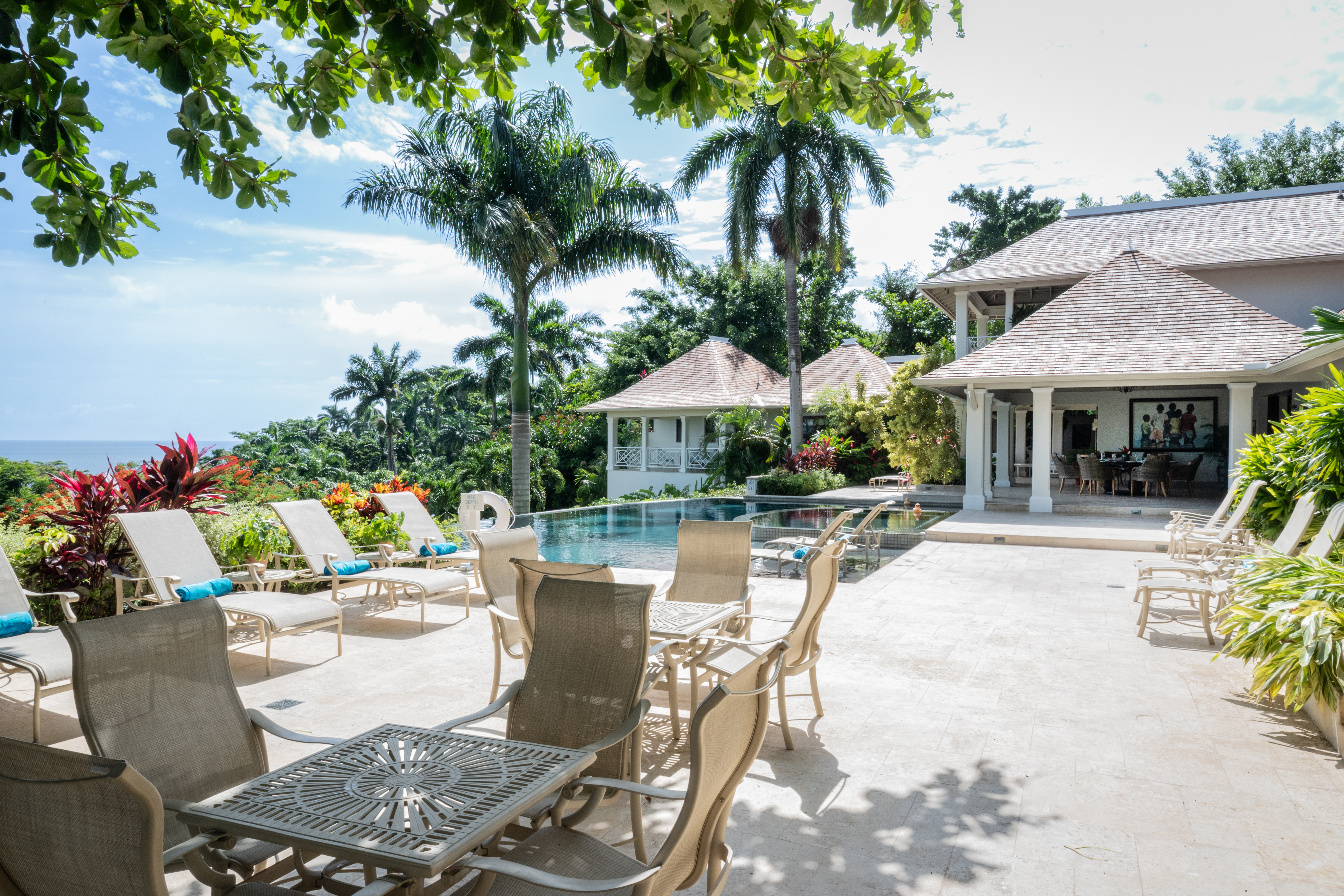 Someday Soon villa outdoor seating, pool and the Caribbean Sea