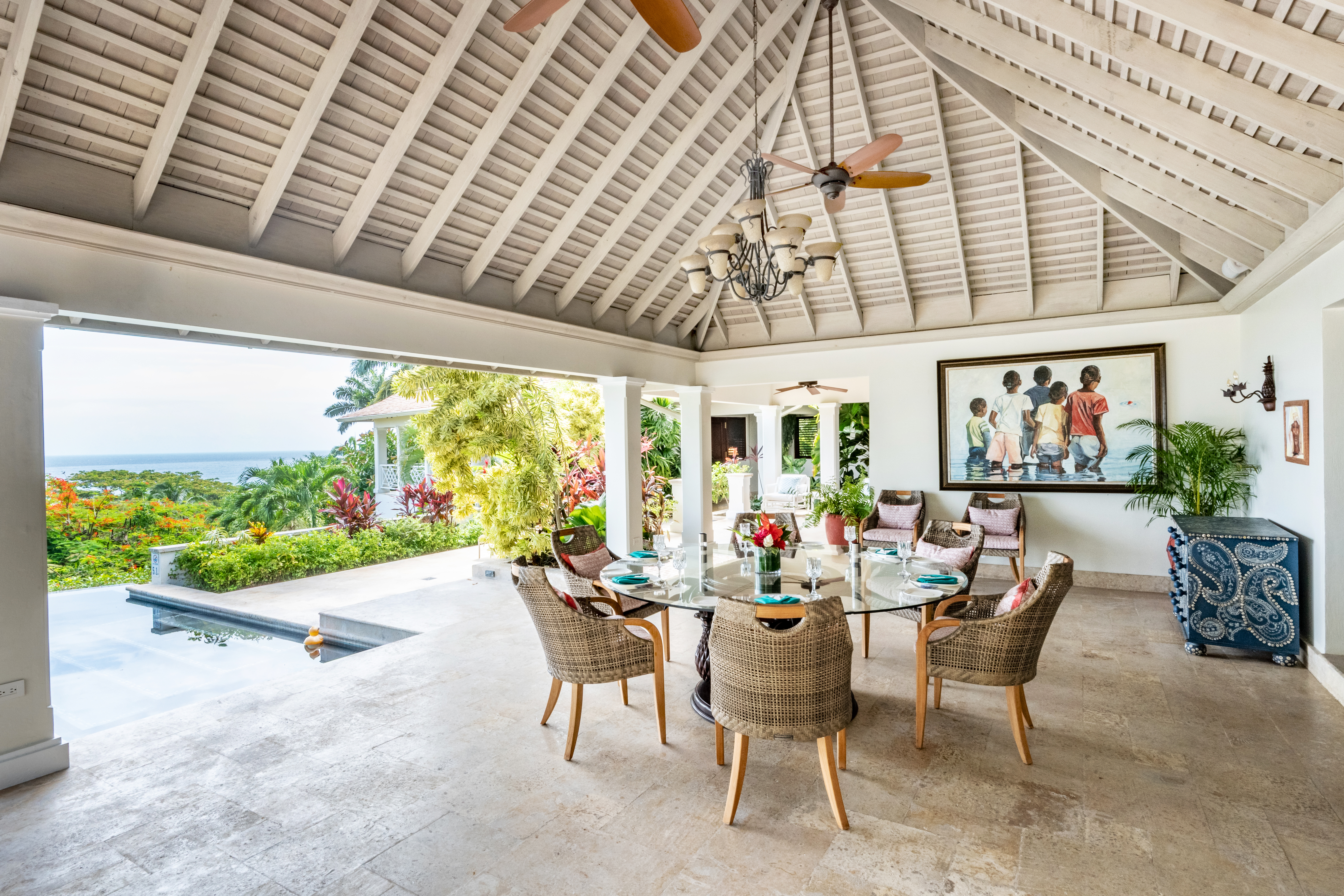 Someday Soon villa table and chairs with a view of the Caribbean