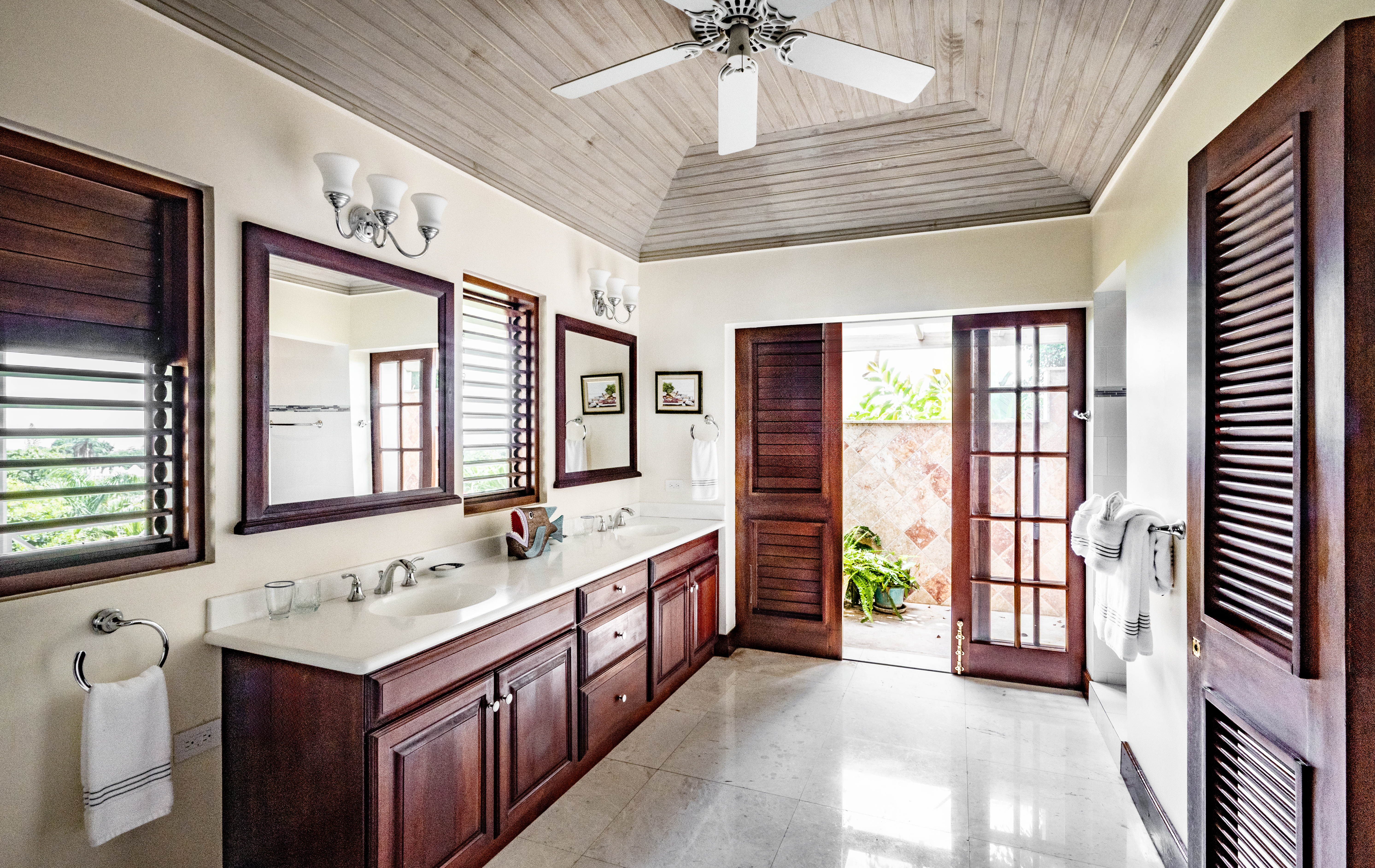 Someday Soon villa wash basins and open door