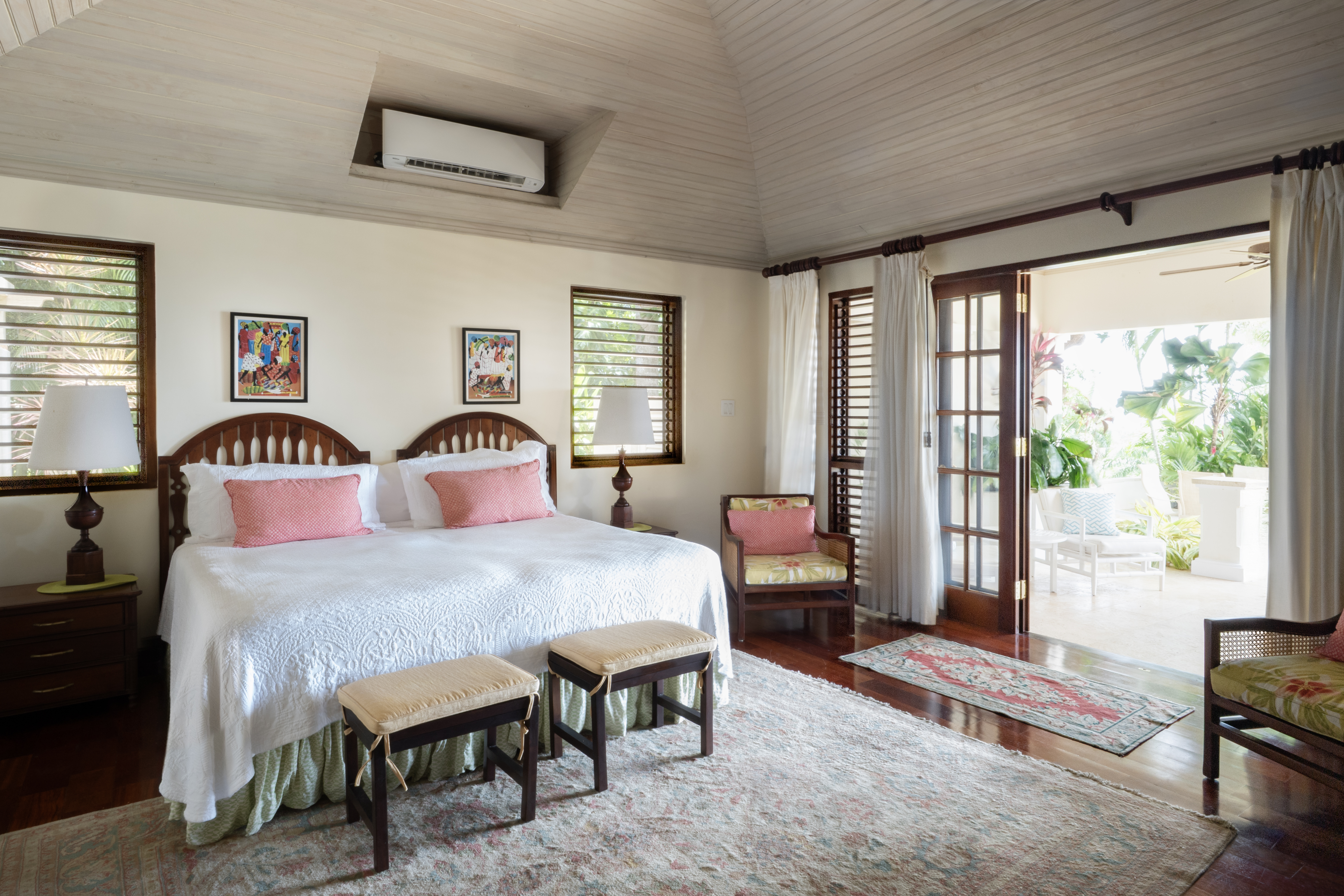 Someday Soon villa room with bed and pink pillows