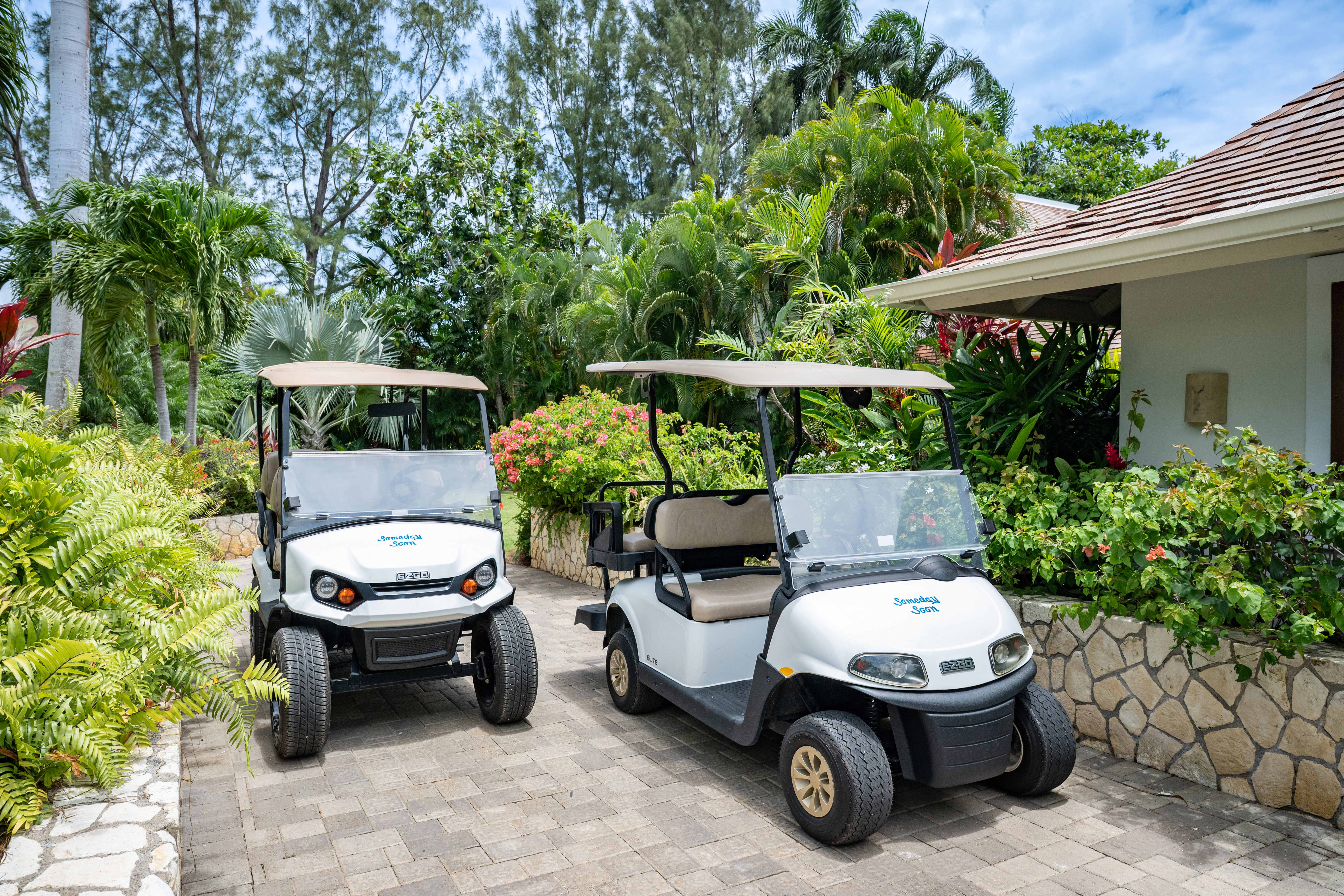 Someday Soon villa two white golf carts