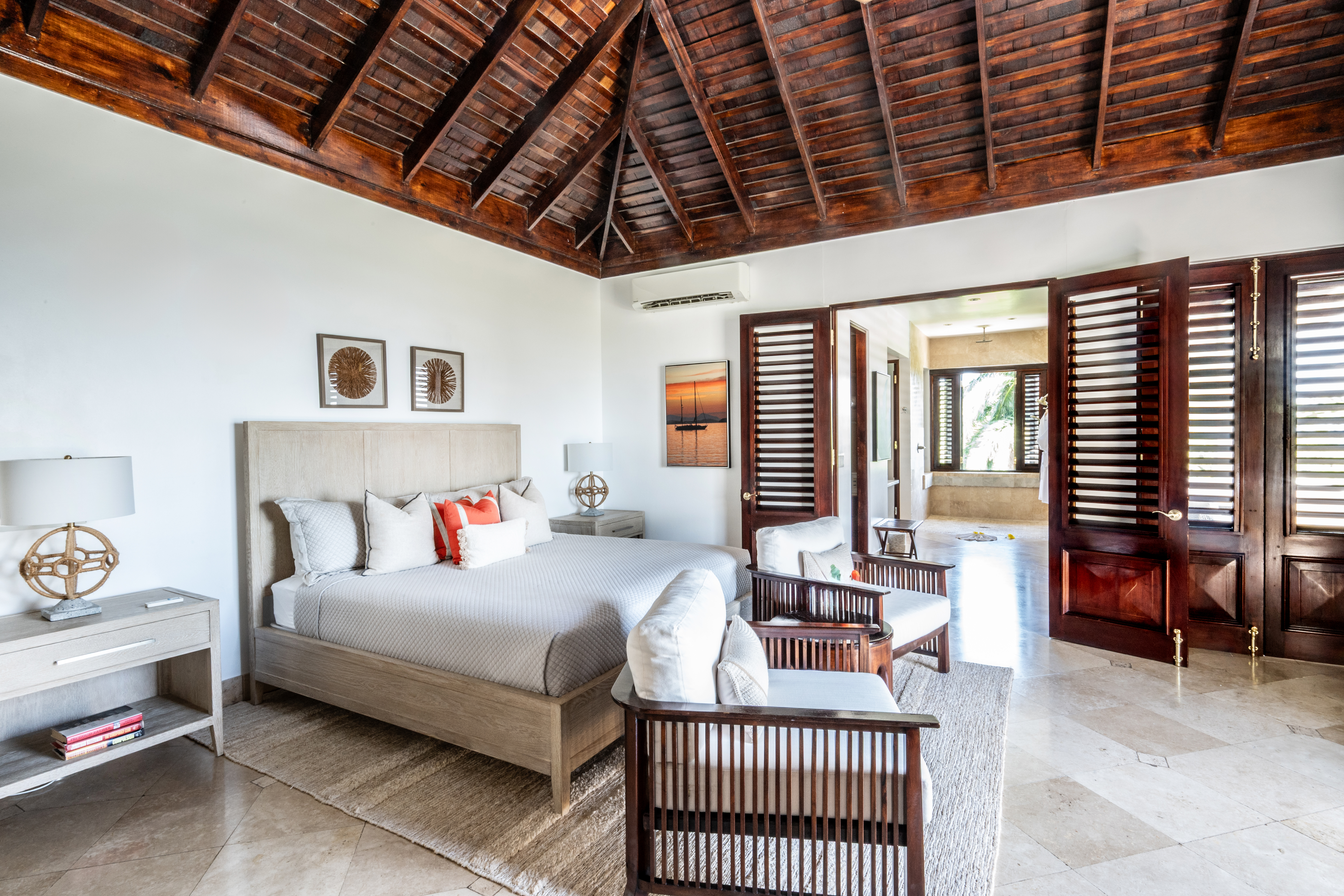 Trinity Villa bedroom with double bed and chairs