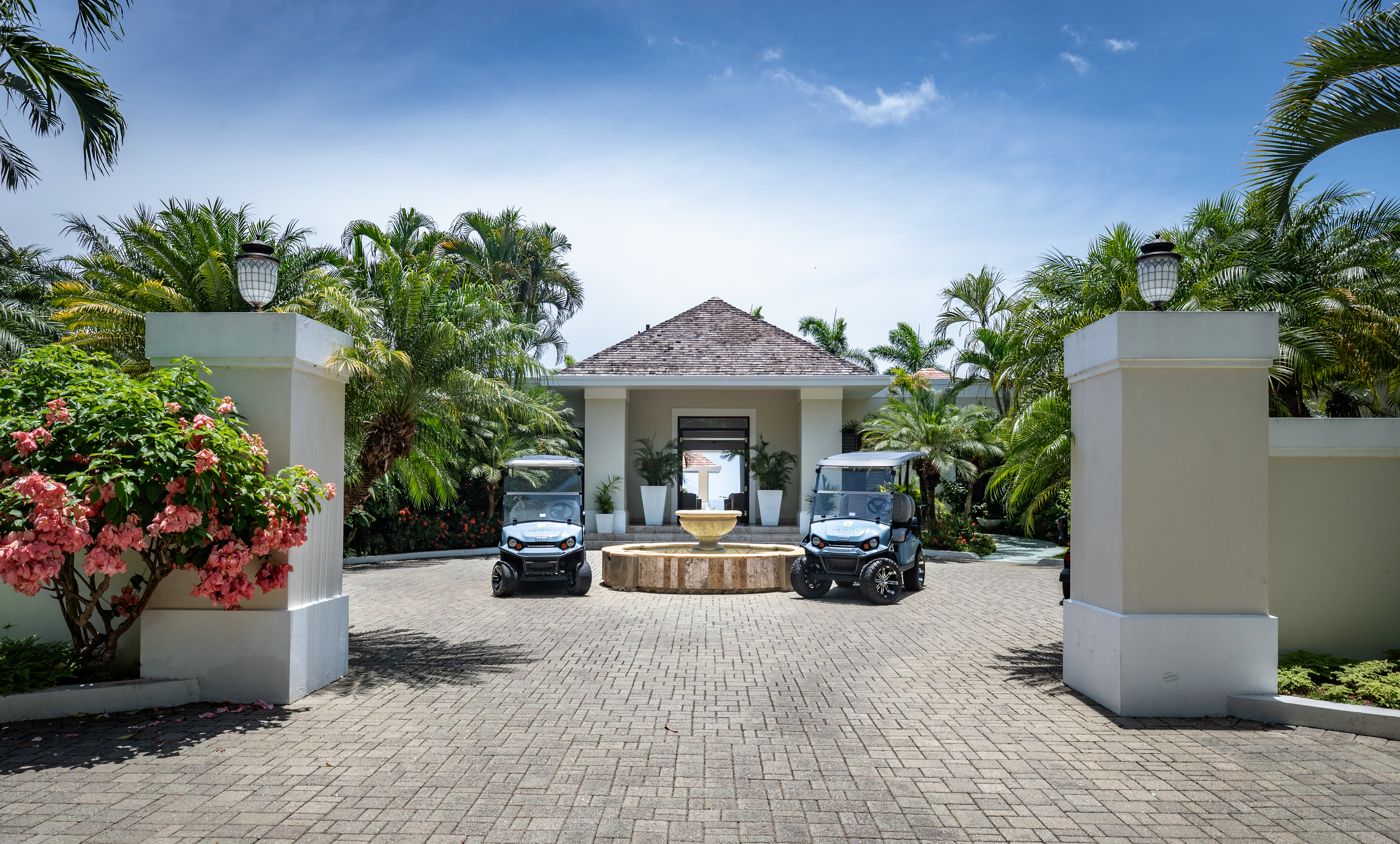 Trinity Villa two golf carts and a building