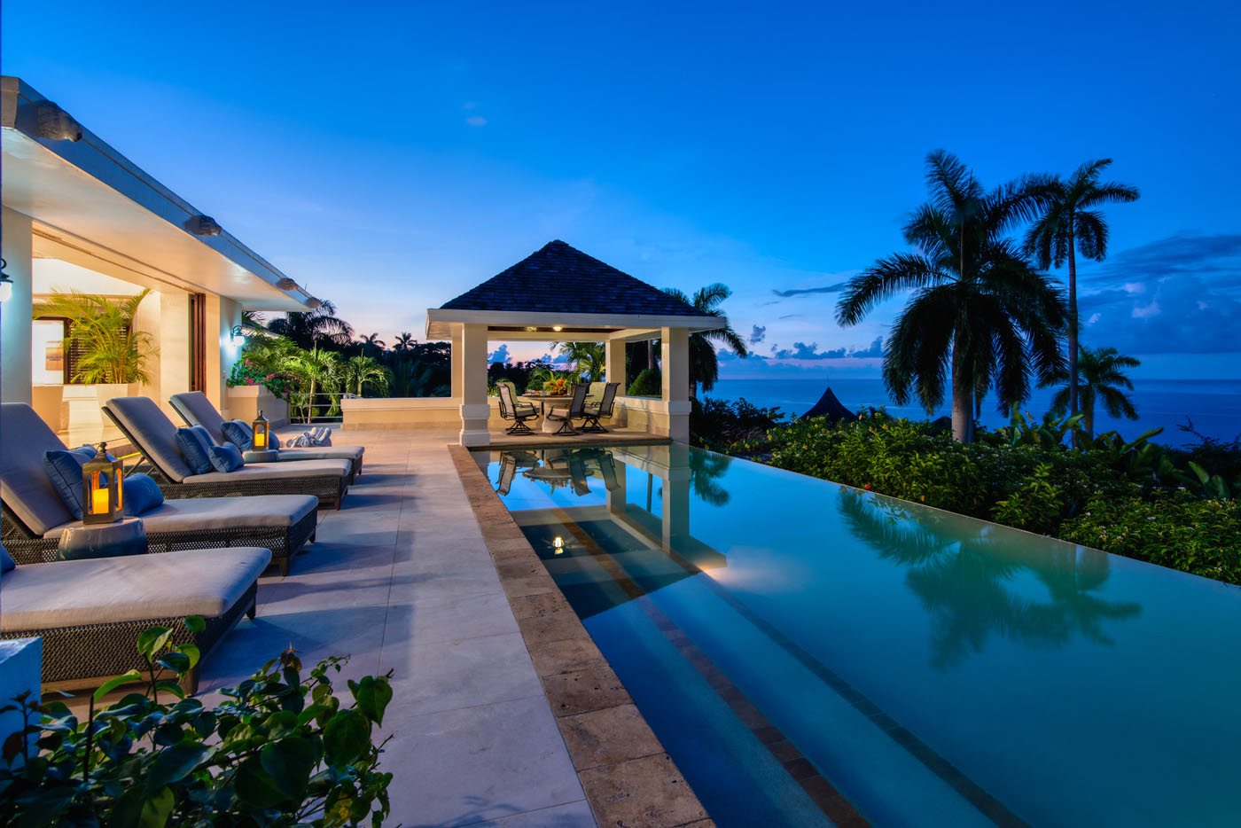Trinity Villa dusk pool areas looking out over the Caribbean