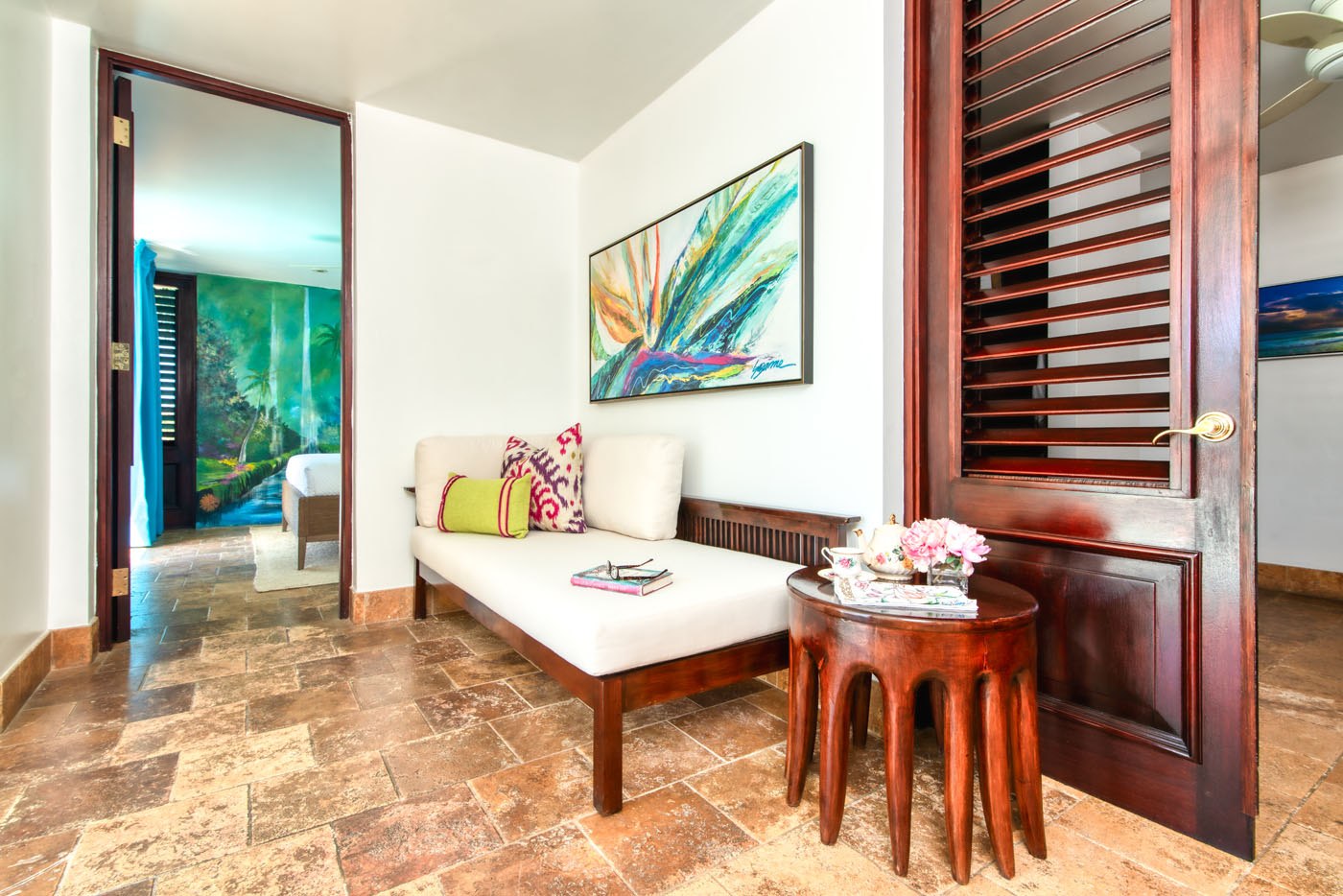 Trinity Villa room with a sofa, table, book and glasses