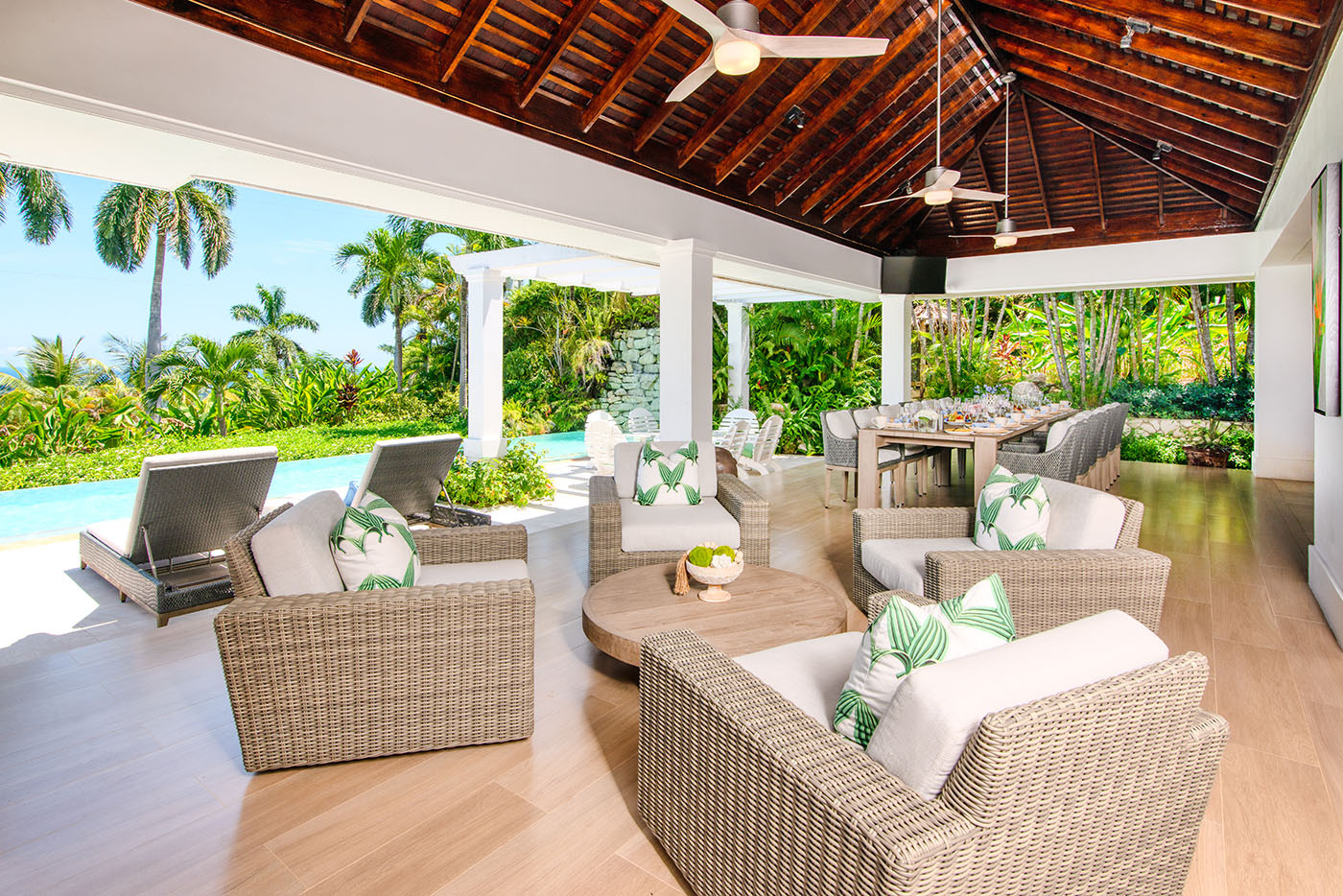 Trinity Villa patio with chairs next to pool